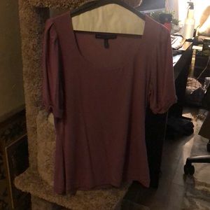 Stretchy, fitted, soft top.  Never worn.